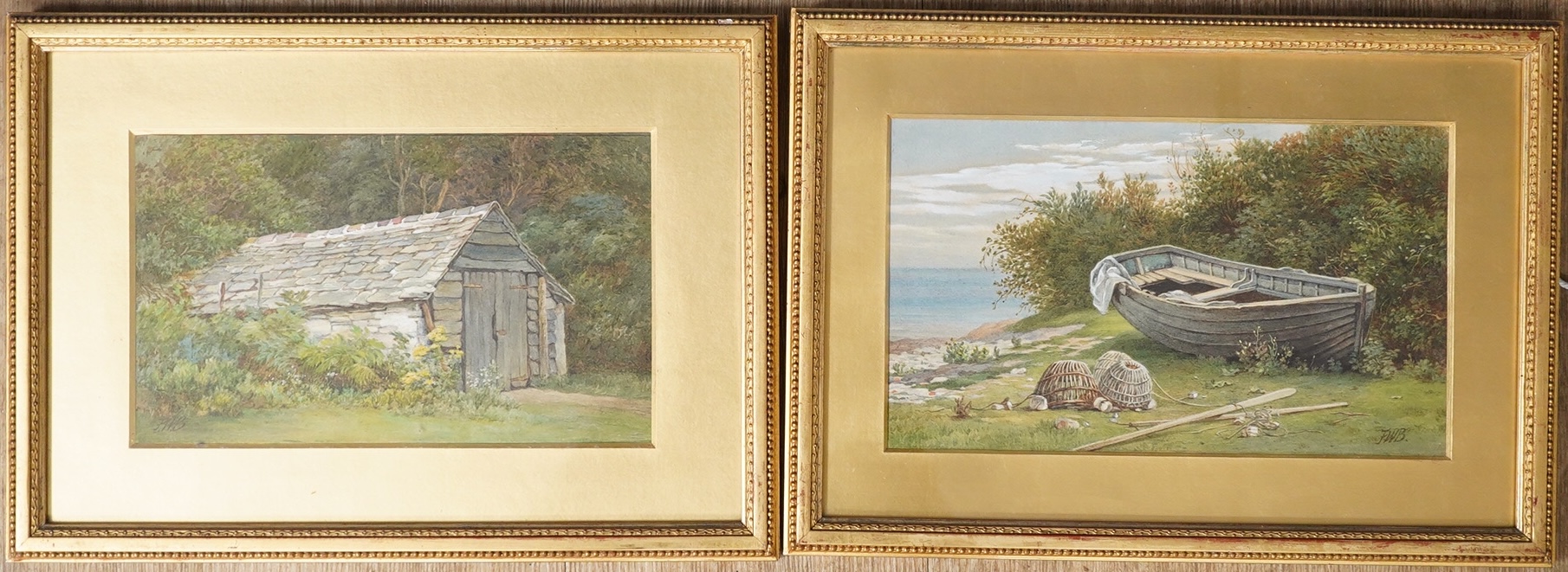 F.W.B., pair of watercolours, Boat shed and Beached boat, each monogrammed, 16 x 27cm, housed in gilt frames. Condition - fair to good